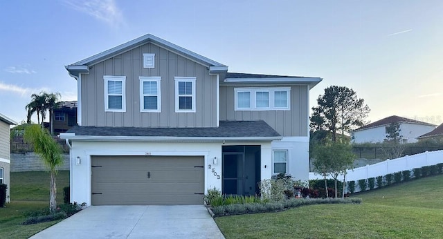 view of front of home featuring a garage and a front lawn