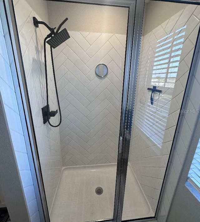 bathroom with an enclosed shower