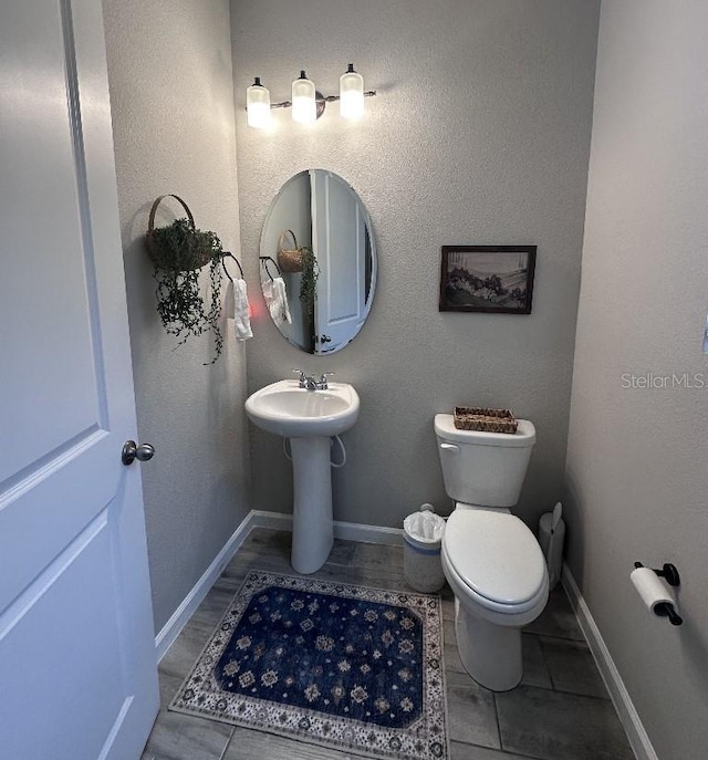 bathroom with toilet and sink