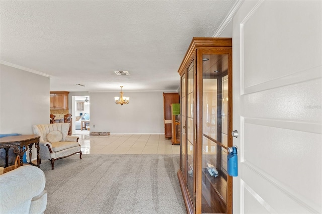 living area featuring light tile patterned floors, ornamental molding, a chandelier, and a textured ceiling