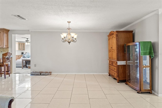 tiled empty room featuring crown molding, ceiling fan with notable chandelier, and a textured ceiling