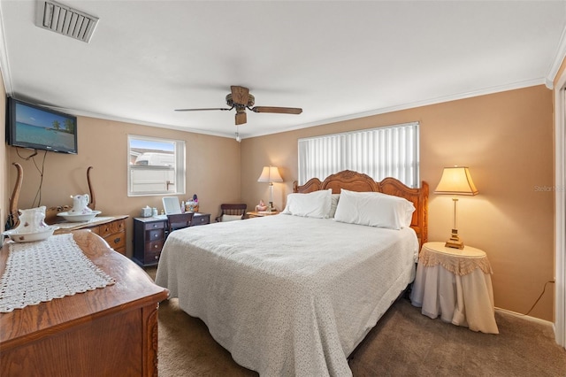 carpeted bedroom featuring crown molding and ceiling fan