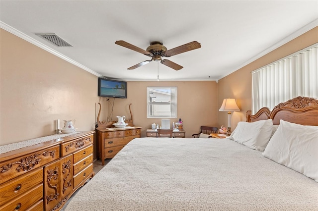 bedroom with ornamental molding and ceiling fan