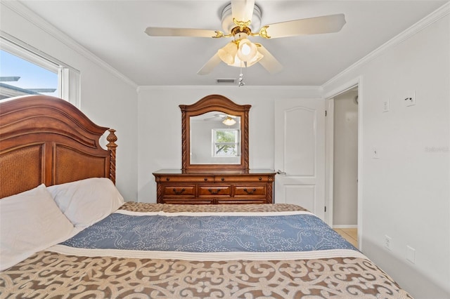 unfurnished bedroom with crown molding, ceiling fan, and multiple windows