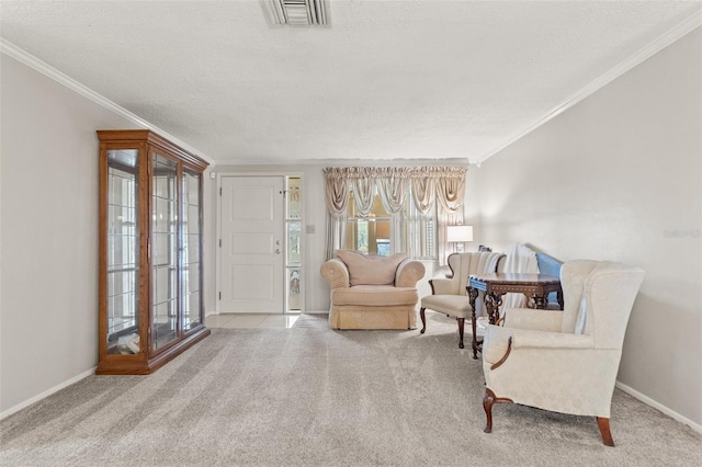 sitting room featuring crown molding, light colored carpet, and a textured ceiling