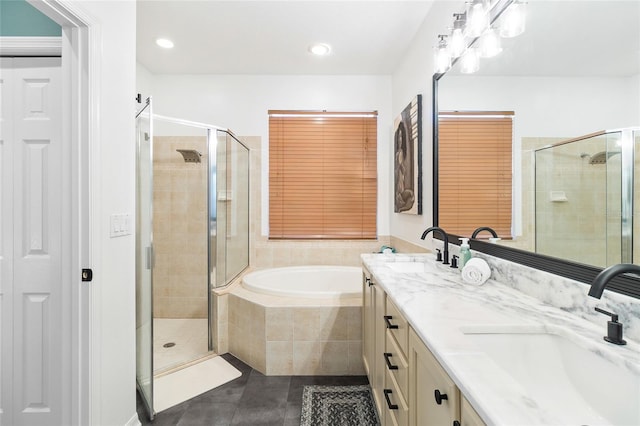 bathroom featuring vanity, plus walk in shower, and tile patterned flooring