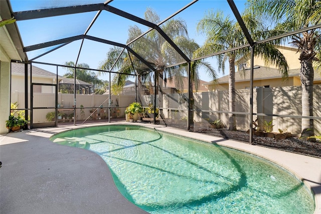 view of swimming pool with a lanai and a patio area