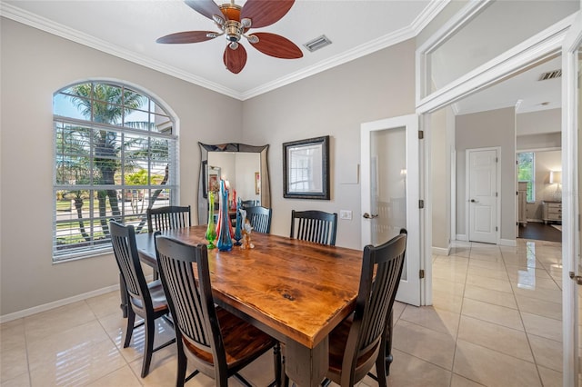 dining space featuring ornamental molding, light tile patterned flooring, and ceiling fan