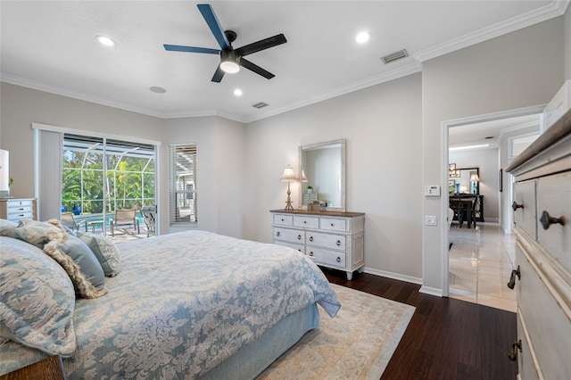 bedroom with dark wood-type flooring, crown molding, and access to exterior