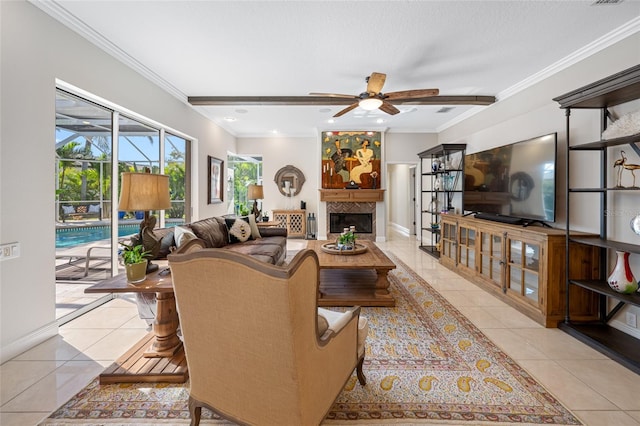 tiled living room with ceiling fan and crown molding