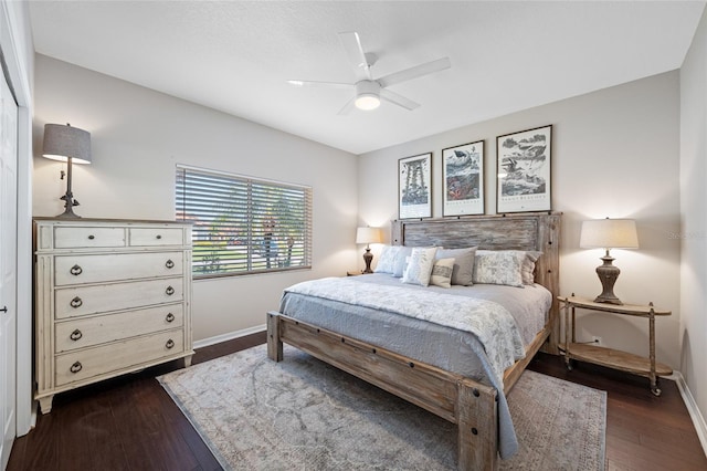 bedroom with ceiling fan and dark hardwood / wood-style flooring