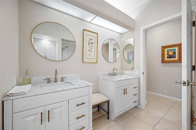 bathroom with tile patterned flooring and vanity