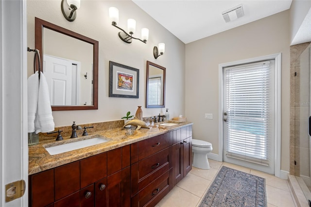 bathroom with tile patterned flooring, vanity, toilet, and a shower with door