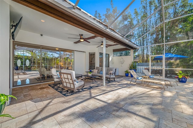 view of patio / terrace featuring ceiling fan, a lanai, and an outdoor hangout area