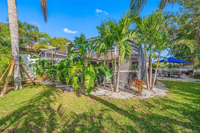 view of yard with a lanai