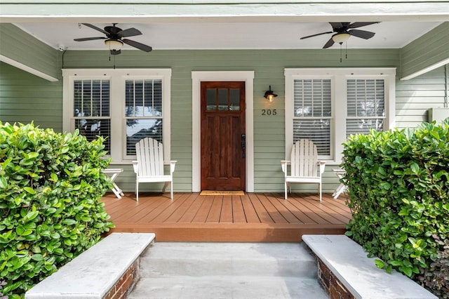 doorway to property with covered porch and ceiling fan