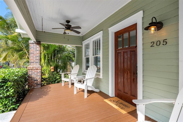 deck with a porch and ceiling fan