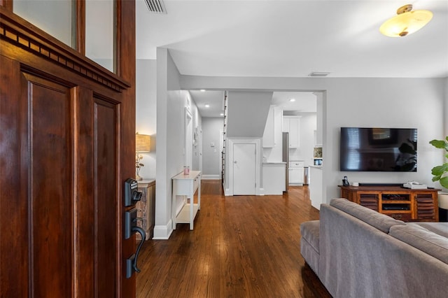 living room with dark hardwood / wood-style flooring