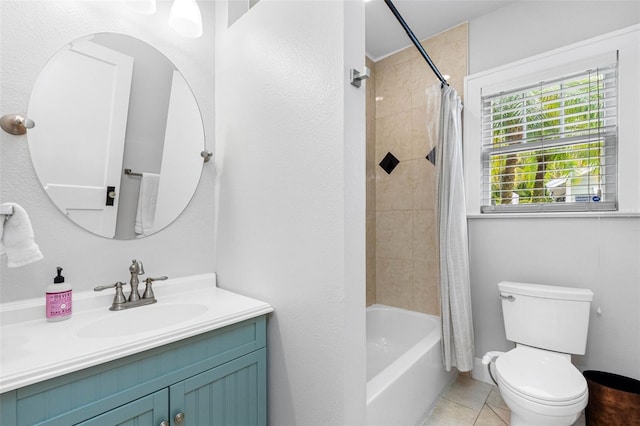 full bathroom with vanity, toilet, tile patterned flooring, and shower / bath combo with shower curtain