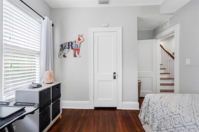 bedroom featuring dark hardwood / wood-style floors