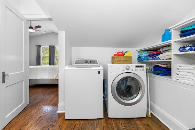 clothes washing area with ceiling fan, dark hardwood / wood-style floors, and washer and dryer