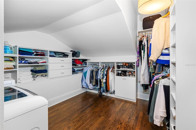 walk in closet with lofted ceiling and dark hardwood / wood-style flooring