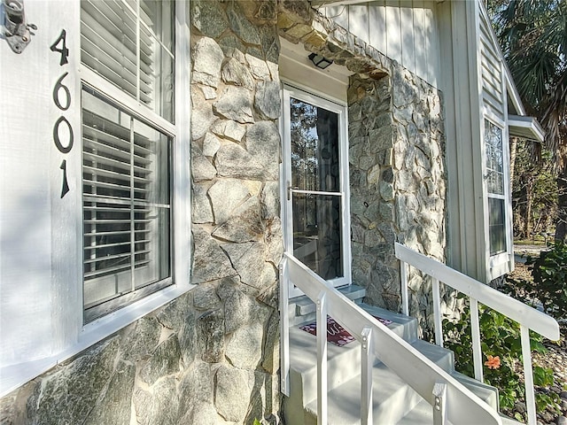 exterior space with stone siding