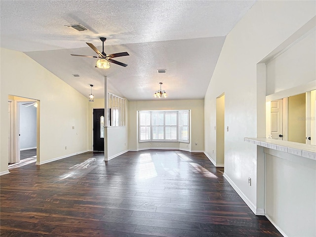 unfurnished living room featuring lofted ceiling, ceiling fan, visible vents, and dark wood-style flooring