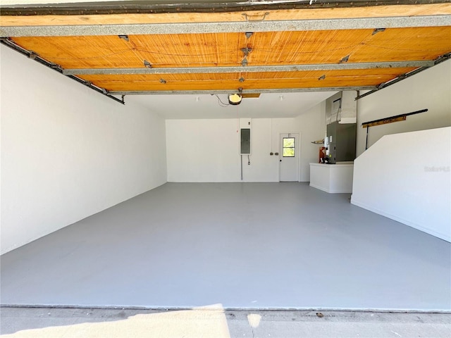 garage with heating unit, electric panel, and a garage door opener