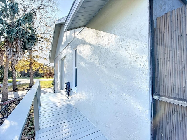 view of side of property with stucco siding