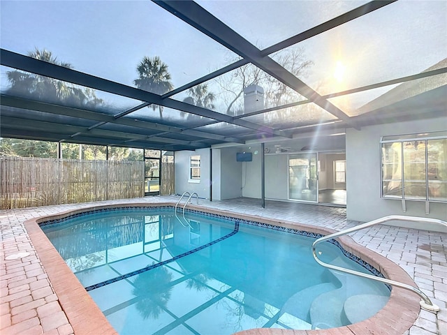 view of pool featuring a fenced in pool, a lanai, fence, and a patio