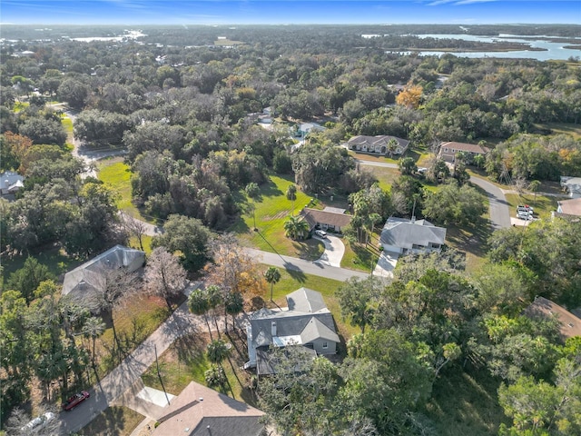 birds eye view of property with a residential view and a water view