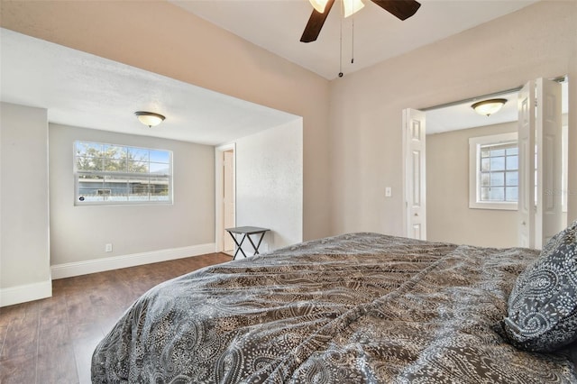 bedroom with dark wood-type flooring