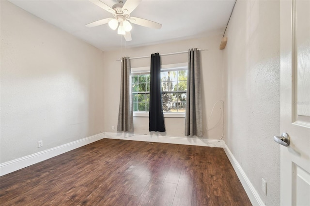 spare room with hardwood / wood-style flooring and ceiling fan