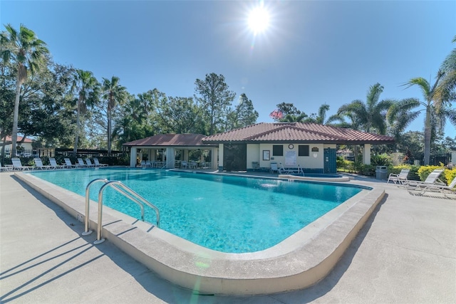 view of swimming pool with a patio