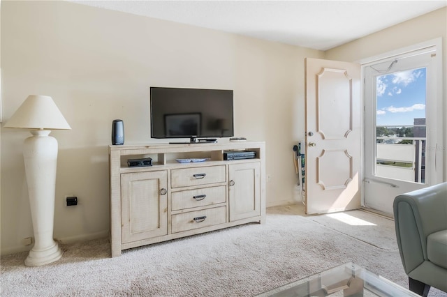 living area featuring light colored carpet