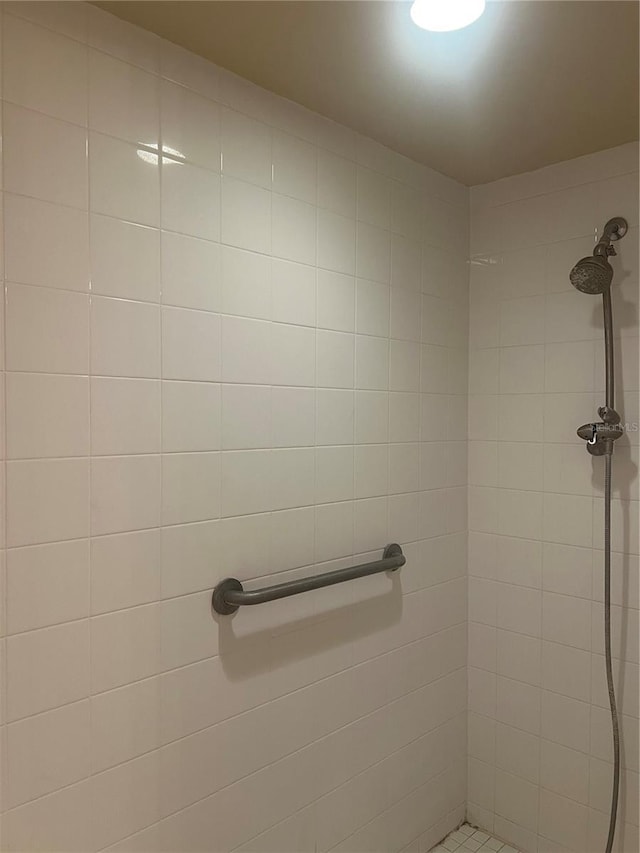 bathroom with tiled shower