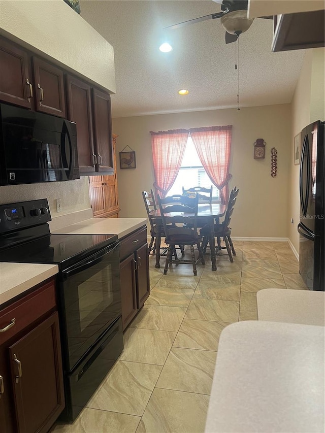 kitchen featuring ceiling fan, dark brown cabinets, a textured ceiling, and black appliances