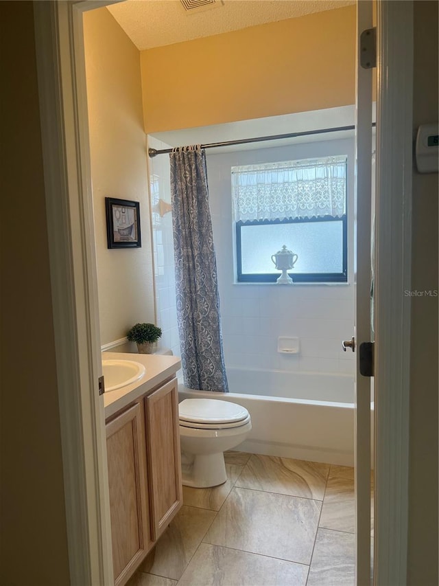 full bathroom featuring vanity, shower / tub combo, and toilet