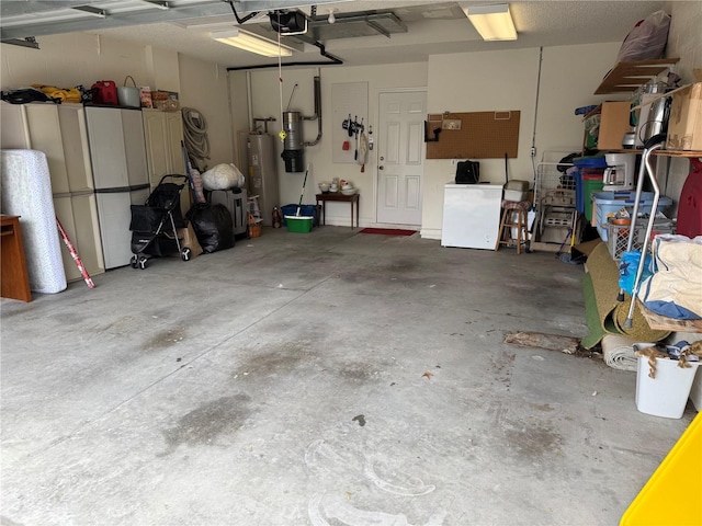 garage featuring a garage door opener and water heater