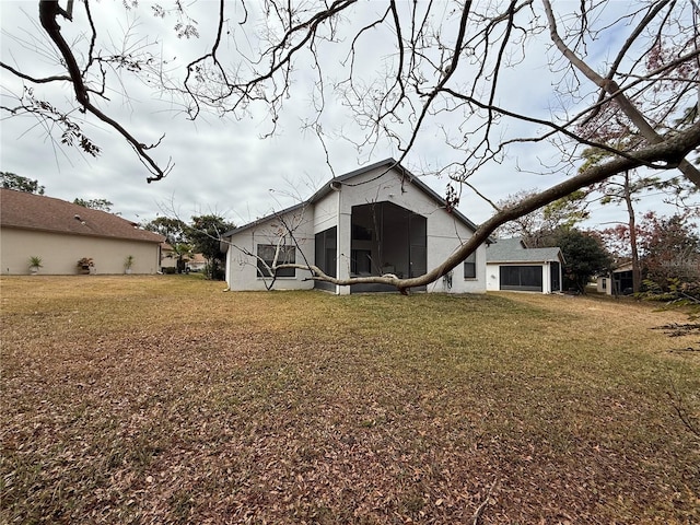 back of property with a lawn