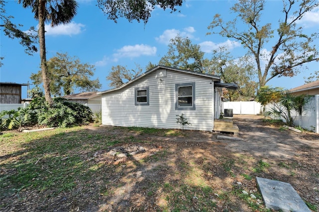 view of side of property featuring central AC unit