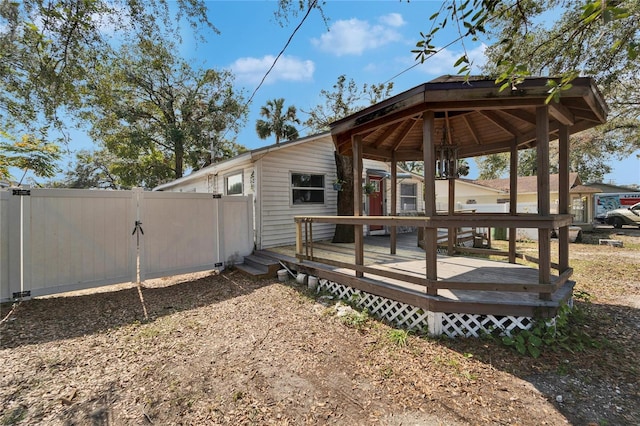 exterior space featuring a gazebo and a wooden deck