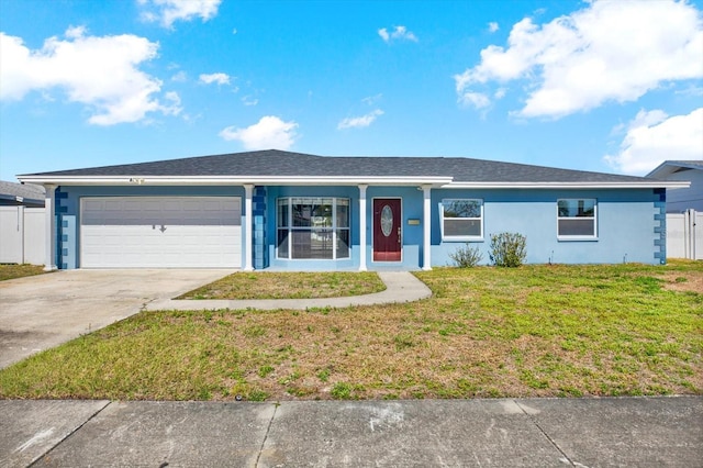 single story home featuring a garage and a front yard