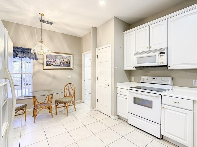 kitchen featuring white cabinetry, hanging light fixtures, white appliances, and light tile patterned floors