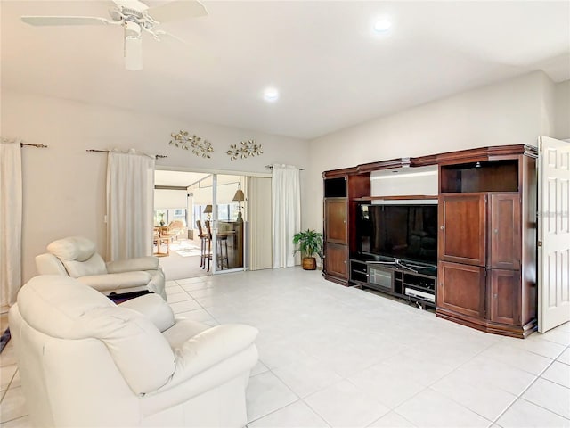 tiled living room with ceiling fan