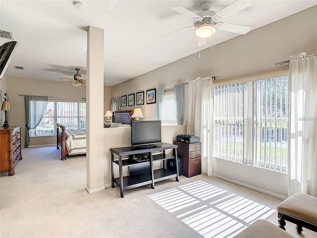 carpeted living room featuring ceiling fan