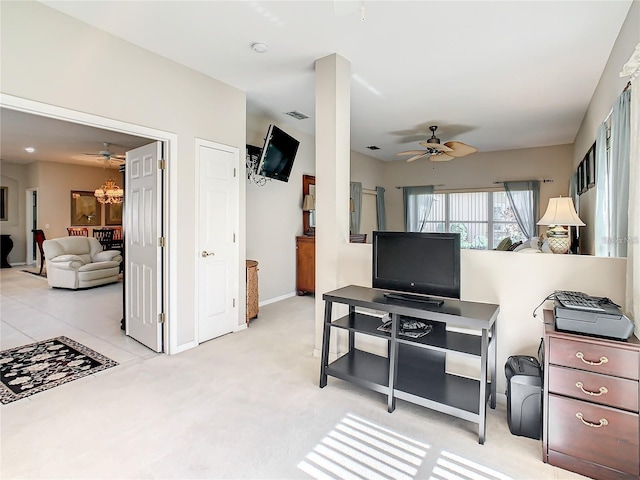 carpeted living room with ceiling fan