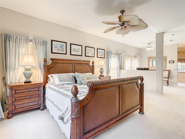 bedroom featuring light carpet and ceiling fan