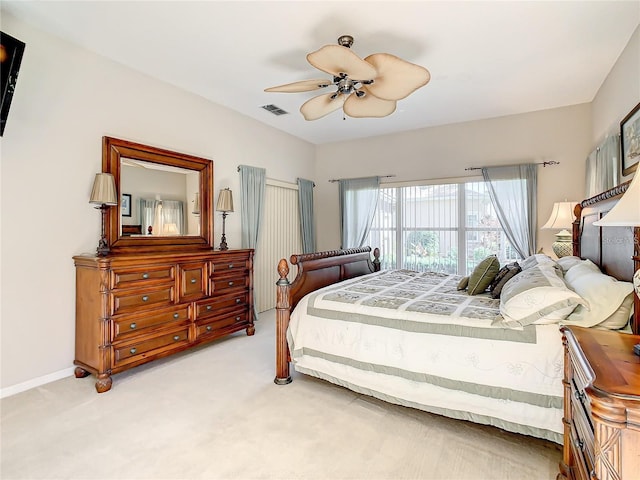 bedroom featuring light carpet and ceiling fan